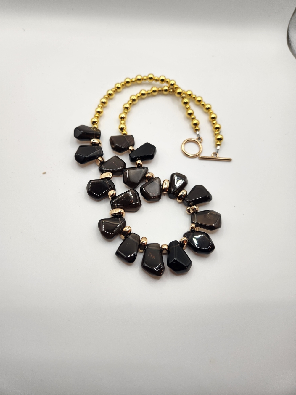 Gold Bead Necklace with Black Faceted Stone Drops